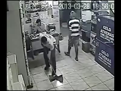 Store Owner sitting at his Desk takes Fatal Bullet to the Chest during Robbery