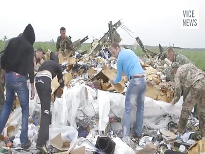 Shocking and Disturbing Aftermath of Bodies in a Field From Malaysian Flight MH17