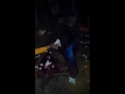 Man Bleeding out in Total Agony from Several Machete Blows