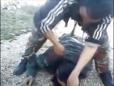 New Beheading Shows Rebel Taking off a Syrian Soldiers Head with a Army Knife