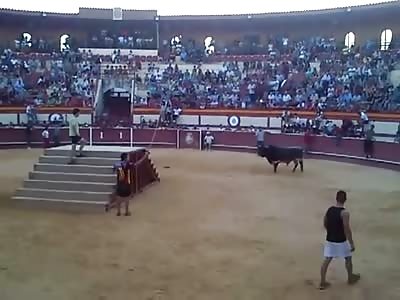 Bull Goes Crazy on Dude in Blue Shirt Chasing him Up Stairs and Crushing Him on the Way Down