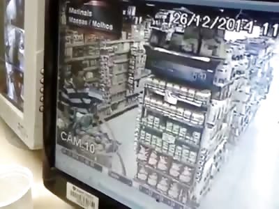 Striped Shirt Man Executes Shopper Browsing in a Supermarket 