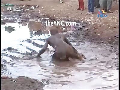 Just a Drugged black Man Swimming in the Dirt