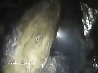 UK man almost drowned after getting stuck between rocks in a deep cave. 