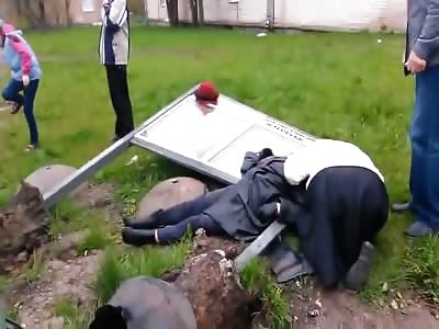 A Woman Lies Dead After Being Crushed Behind A Car And Sign - Video