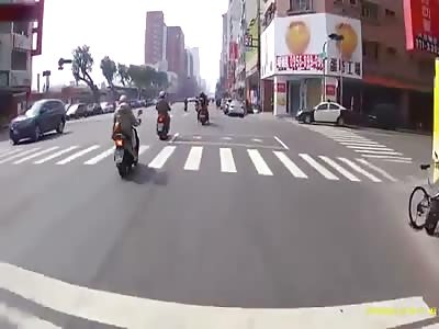 One LUCKY Scooter Rider Narrowly Missed the Tires of a Truck