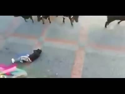 Quick Attack by a Bull leaves a Man Bleeding Out on the Cement 