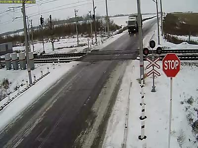 Slippery... truck almost made it through the crossing... ALMOST (freight train derailment bonus)