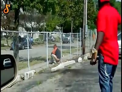 WTF LMFAO - Black Man Caught Taking a Shit on Fence in Broad Daylight