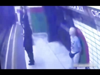 Man Pushes Muslim Woman Against Oncoming Train