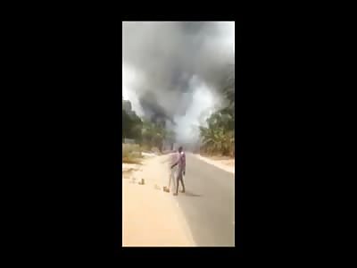 Man Walks Burned and Charred Down the Street
