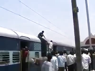 Indian Electrocuted on Train Wire.
