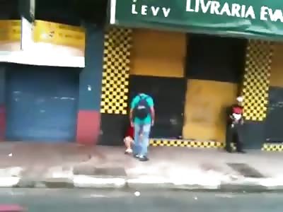 Brazilian bum provokes student and receives a BRUTAL kick to the face