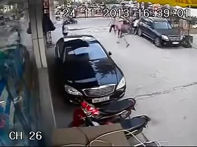 Guy gets a brick and several kicks to the head