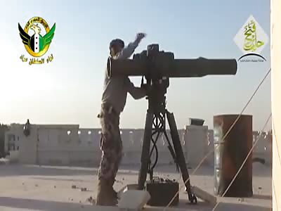Watch the Red Dot:  TOW MISSILE THROW-DOWN MUSLIMS OF BUILDING ROOF