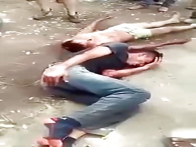 THIEVES BEING BEATEN AND TIED BY POPULATION