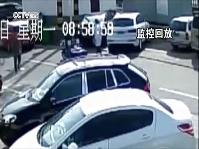 BABY FALLS FROM CAR AS WOMAN MOVES CAR OUT OF PARKING