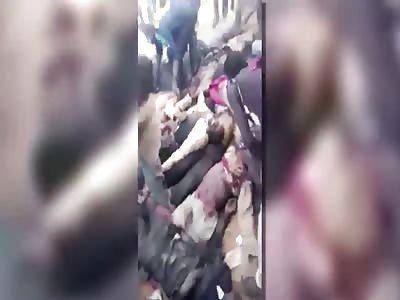 PILE OF CORPSES BEING LOOTED IN NIGERIA