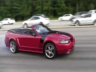 RED GT MUSTANG LOSES CONTROL AND NAILS THE CURB