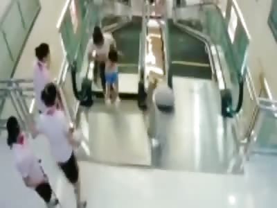 Chinese dies in escalator but saved his son