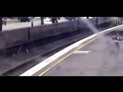 Woman saves schoolgirl from train tracks with seconds to spare 