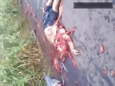 Terrible head-on collision aftermath - woman lie dead on the ground next to completely crushed man 