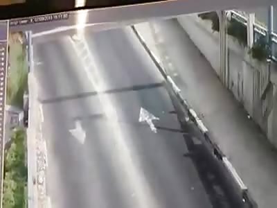 Truck knocks down overhead beam which smashes into Van