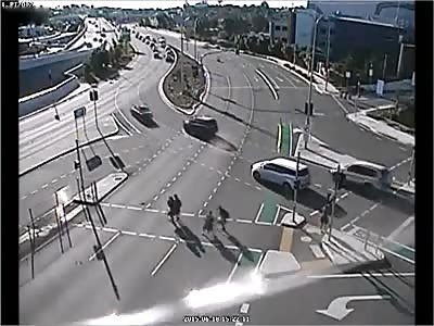 Motorcyclist clips car and narrowly misses pedestrians in shocking CCTV