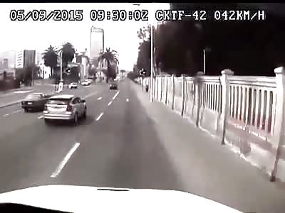 Idiot driver makes a BMW crash head on with a truck 