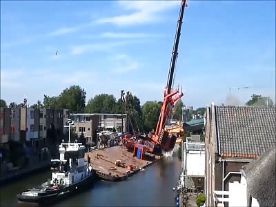 Crane collapses onto houses in Alphen, The Netherlands. 2 ANGLE VIEWS