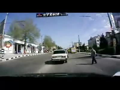 Man hit by car ( & flying cap )