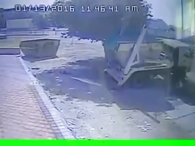 Truck falls into hole