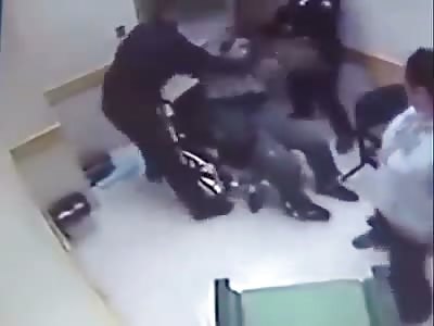 SHOCKING!! dude in wheelchair beaten by the police while in custody