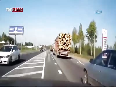 Car Takes Down 2 Trucks including a Log Truck on the Highway