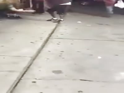 woman is savagely beaten on the street by a guy and another woman
