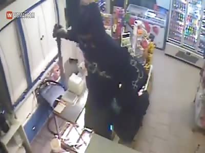 Machete weilding masked man attempts to rob a store, fails miserably.
