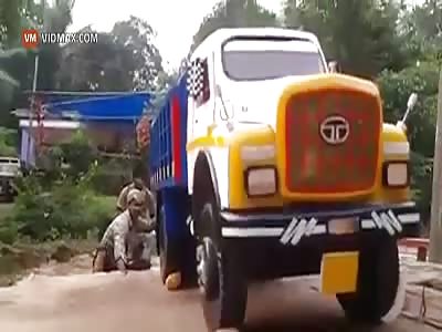 Nothing to see here, just some Indian dudes washing a truck... Or...?